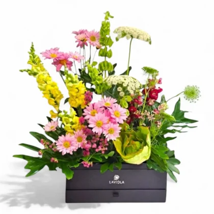 Enchanting spring bouquet featuring pink Chrysanthemums, yellow, green, and white flowers arranged elegantly by LaViola Flowers.