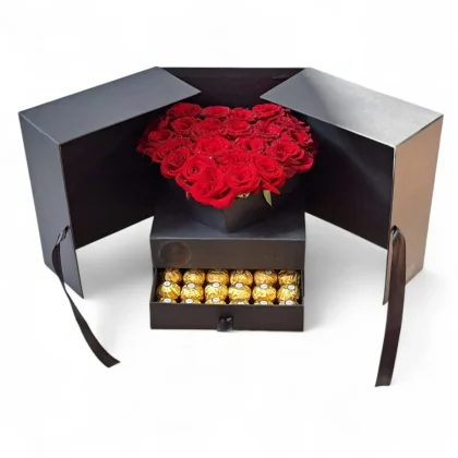 Luxury flower box with two interlocked heart designs made of red roses, featuring a hidden drawer filled with Ferrero Rocher chocolates.